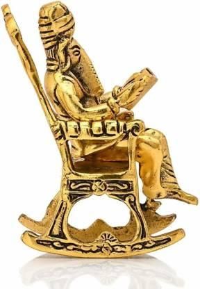 Golden Statue Sitting On A Rocking Chair
