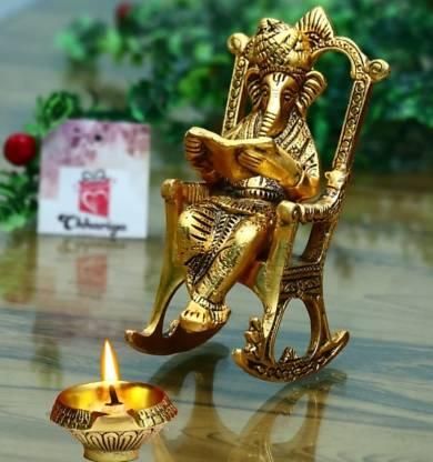 Golden Statue Sitting On A Rocking Chair