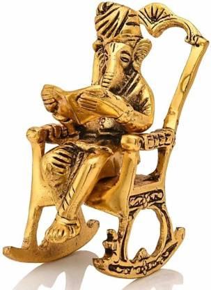 Golden Statue Sitting On A Rocking Chair